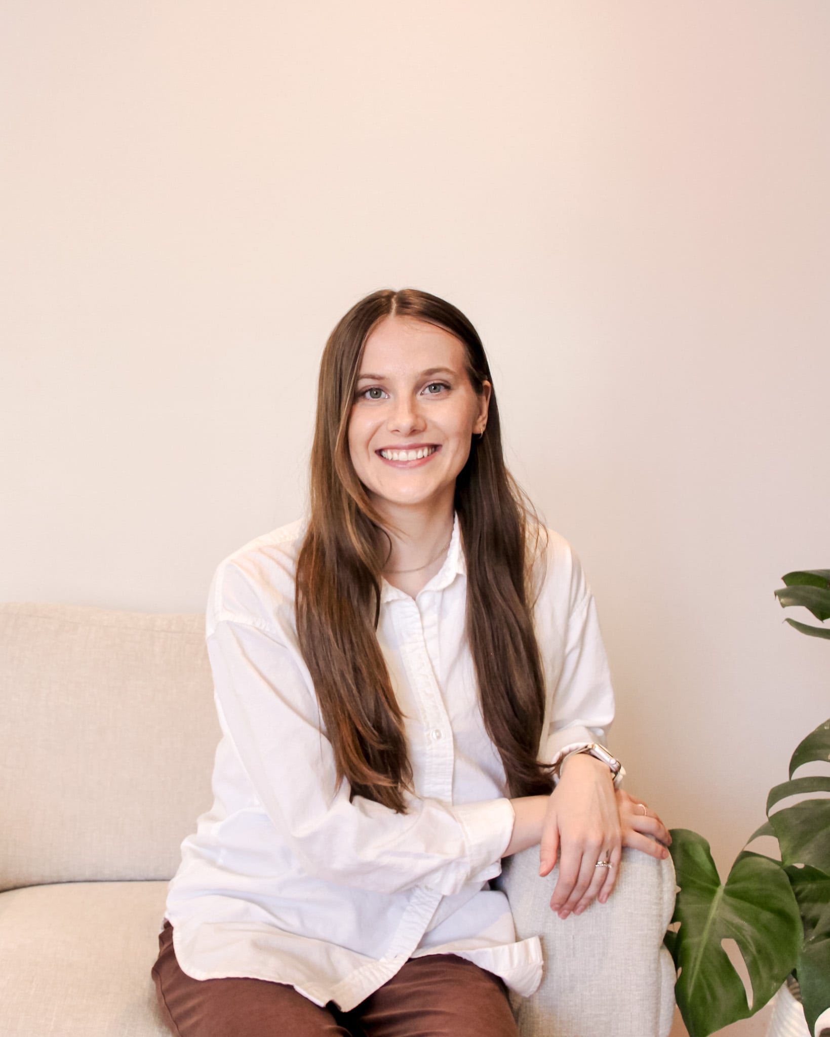 Registered Psychotherapist (Qualifying) Shawna Tiles - Professional Mental Health Support Shawna Tiles, a Registered Psychotherapist, smiling in a warm, inviting home office setting.